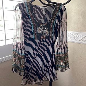 Diane vonFurstenberg silk blouse with beaded detail.